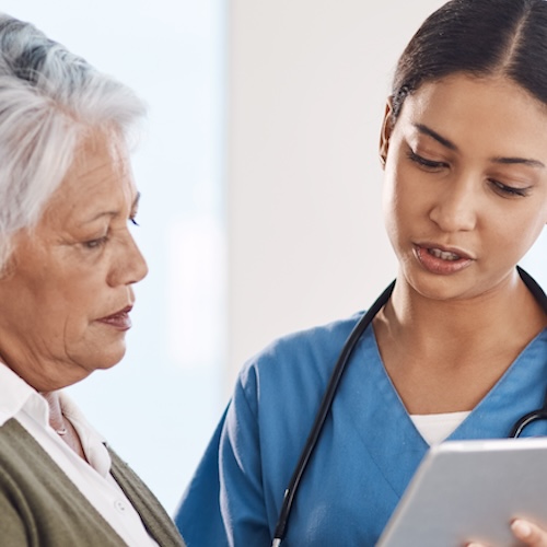 Healthcare, senior woman or doctor with tablet, patient or conversation with connection. Female person, employee or medical professional with mature lady, telehealth or support with diagnosis.